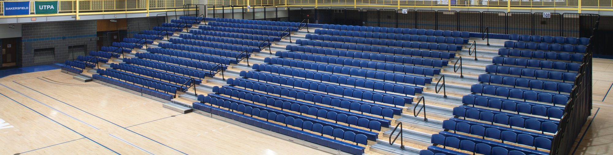Retractable gymnasium bleachers with folding-chair seating